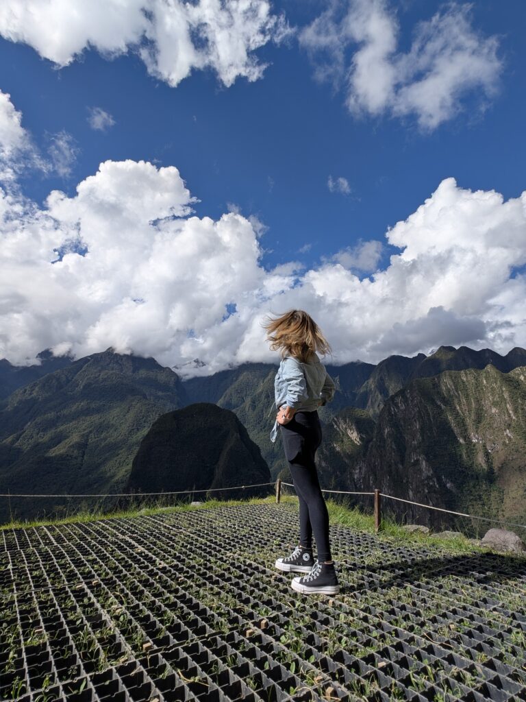 Woman gazing out over Machu Picchu at sunrise – 3 day sacred valley machu picchu itinerary